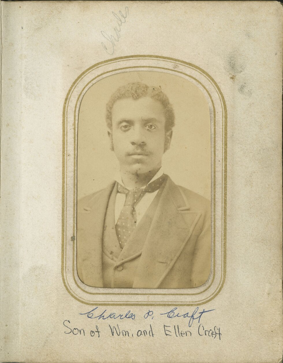 Portrait of a man in a suit looking directly at the camera.