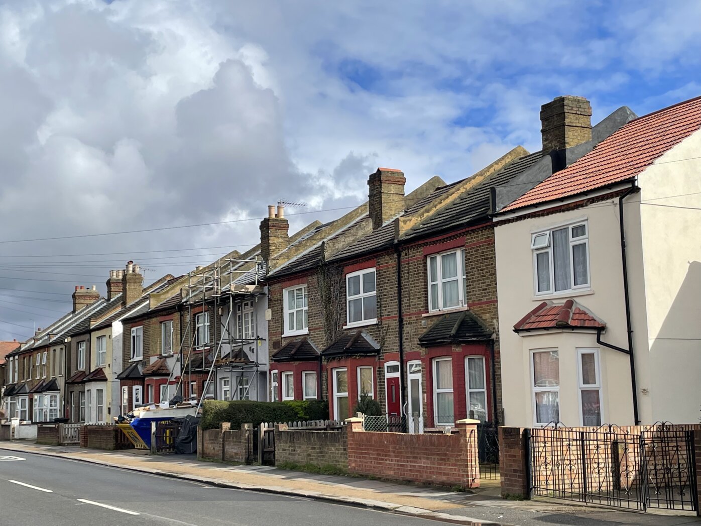 City street with set of two-story row houses.