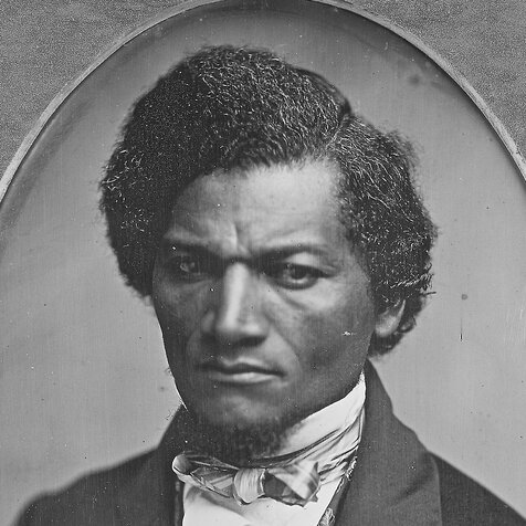 Head and shoulders portrait of Frederick Douglass.