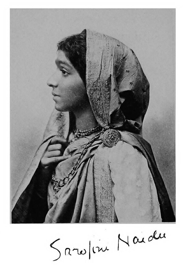 Head and shoulders portrait of Sarojini Naidu, in half profile; facsimile signature below image.