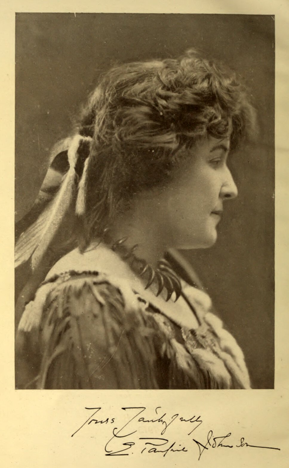 Head and shoulders portrait of E. Pauline Johnson, signed "Yours Faithfully" with her name.