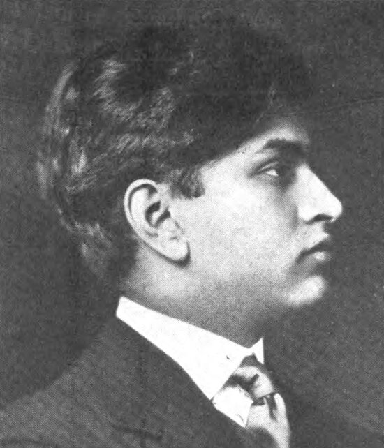 Head and shoulders portrait of Dhan Gopal Mukerji in half profile, facing left.