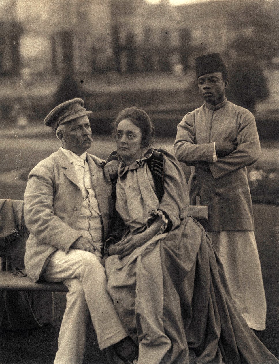 Henry Morton Stanley and Dorothy Stanley, seated, with Saleh bin Osman standing behind them.