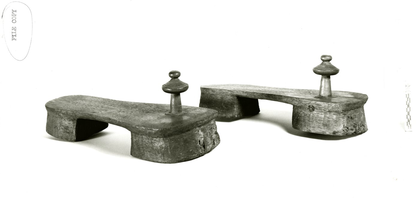 Tippu Tip's inscribed clogs side by side, rotated at 330 degree angle to viewer's right.