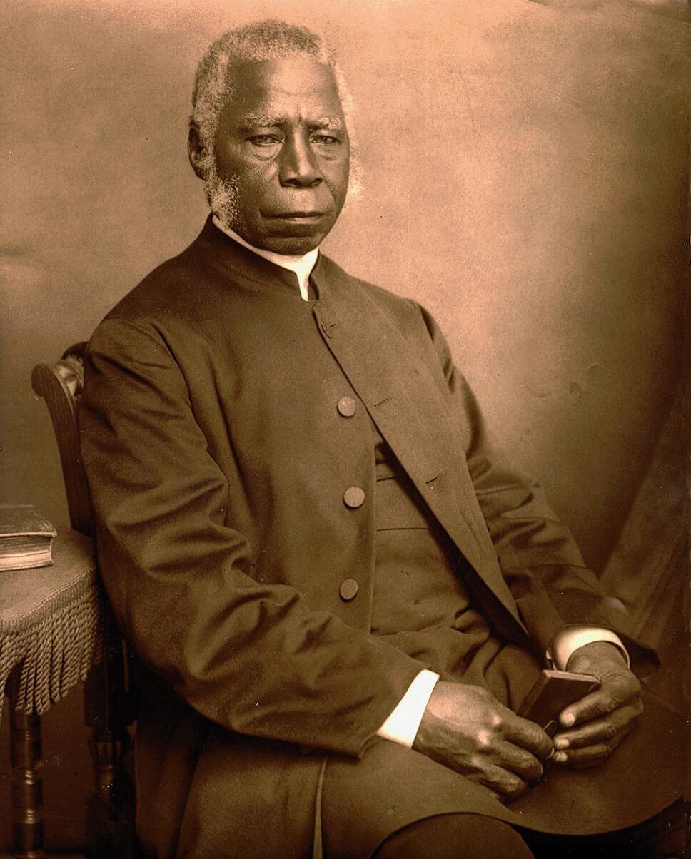 Samuel Ajayi Crowther, seated, in quarter profile turned to his left but facing forward.