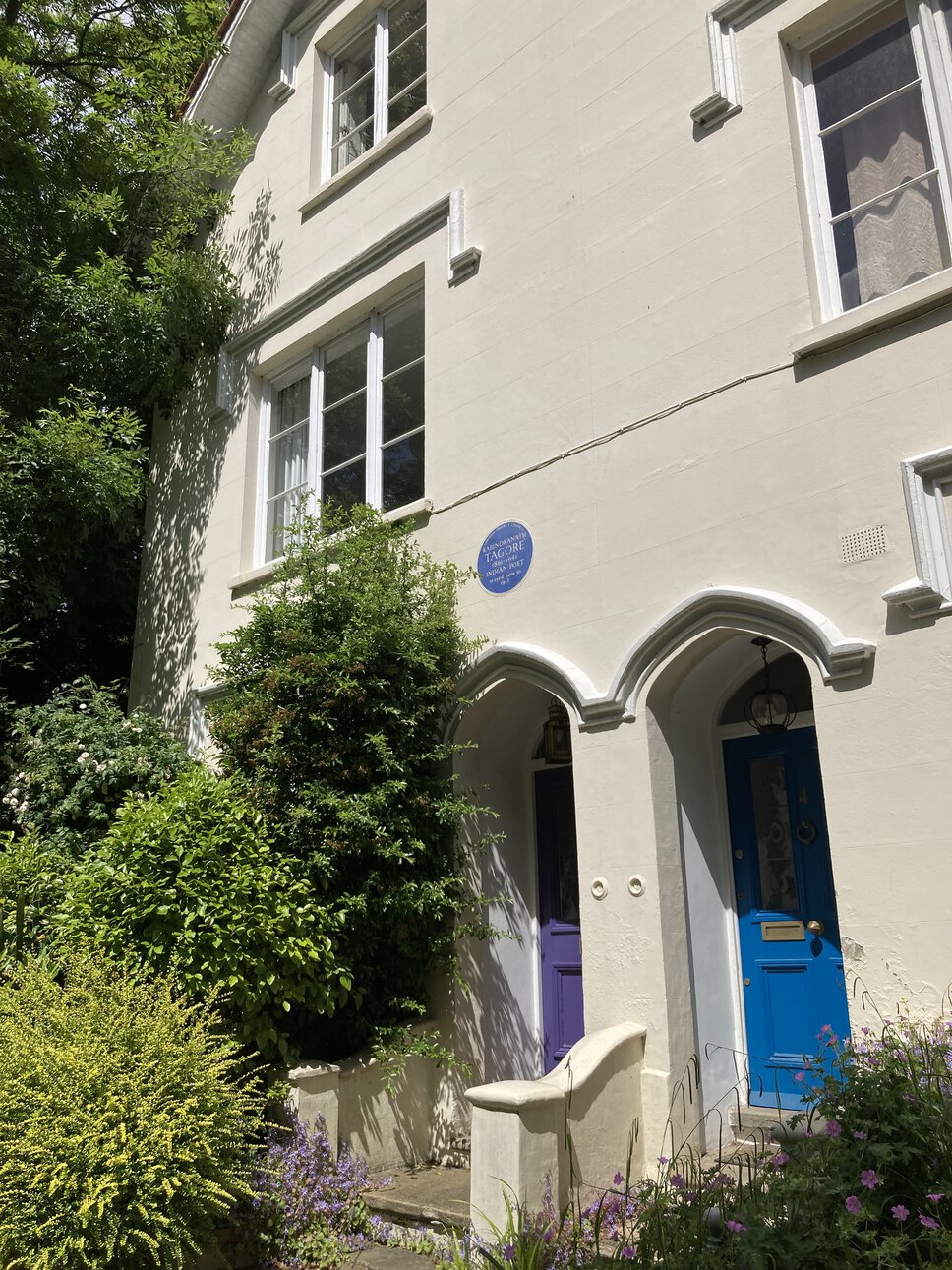 Façade of Rabindranath Tagore residence (1912), showing front door, first story, and second story plus blue plaque.
