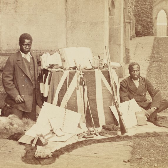 James Chuma and Abdullah Susi beside notebooks, maps, other personal effects of David Livingstone.
