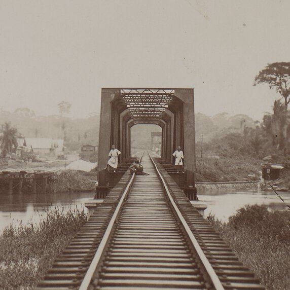Railway bridge with train tracks leading to it.