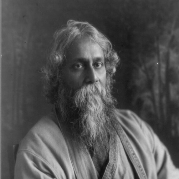 Rabindranath Tagore in three-quarter-length portrait.